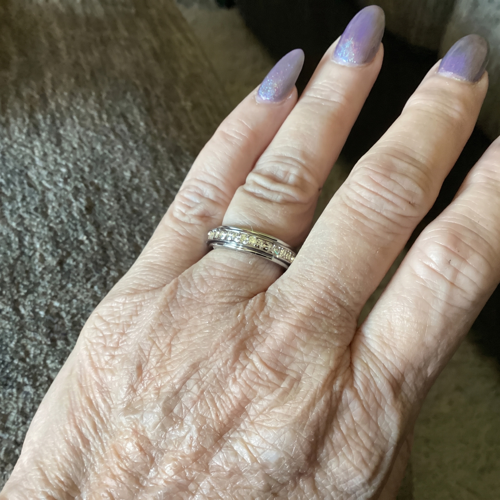 The Calm Ring spinning fidget ring on a woman's hand